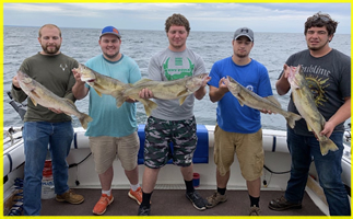 Group of clients with trophy Lake Erie Walleye - 3rd Generation Master Captain Mike Small